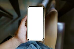 Close up of women's hands holding cell telephone blank copy space screen. smart phone with technology concept photo