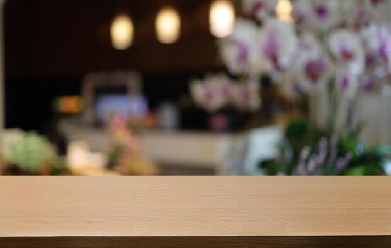 Wood table top in front of abstract blurred background. Empty wooden table space for text marketing promotion. blank wood table surface copy space photo