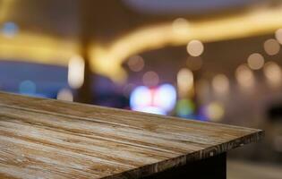 Empty wood table top and blur of out door garden background Empty wooden table space for text marketing promotion. blank wood table copy space for background photo