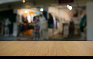 Empty wooden table in front of abstract blurred background of coffee shop . can be used for display or montage your products.Mock up for display of product photo