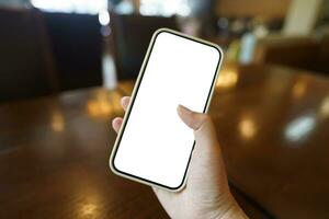 Close up of women's hands holding cell telephone blank copy space screen. smart phone with technology concept photo