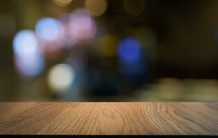 Empty wood table top and blur of out door garden background Empty wooden table space for text marketing promotion. blank wood table copy space for background photo