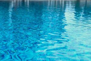 Abstract pool water.  Swimming pool flow with waves background surface of blue swimming pool photo