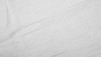 Organic Fabric cotton backdrop White linen canvas crumpled natural cotton fabric Natural handmade linen top view background  organic Eco textiles White Fabric linen texture photo