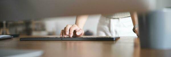 Happy young Asian Woman working on computer Business Data Analyst photo