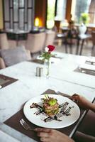 Luxury table settings for fine dining served and decorated table with food for guests in the restaurant photo