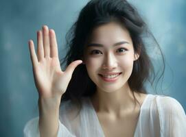 Asian girl showing hand up photo