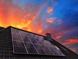 Solar panels producing clean energy on a roof of a residential house photo