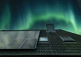 Solar panels producing clean energy on a roof of a residential house photo