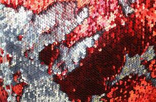 Detailed close up view on samples of cloth and fabrics in different colors found at a fabrics market photo