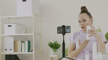 a cosmetologist is showing cosmetic product and function to the camera video