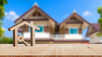 Mockup wooden house and key on wooden table, concept of real estate investment. Planning savings money of coins buy home concept for property, mortgage and real estate investment. photo