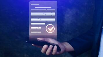 Paperless workplace idea, e-signing, electronic signature, document management system DMS. Businessman signs an electronic document on a digital document on smartphone. photo