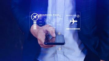 Businessman holding smart phone with boarding pass tickets air travel concept, Choosing checking electronic flight ticket, Booking ticket Online flight travel concept photo