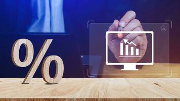 Close-up of percent sign leaning on wooden table, Percentage Sign And Discount Rate. Accountant VAT Tax Concept. photo