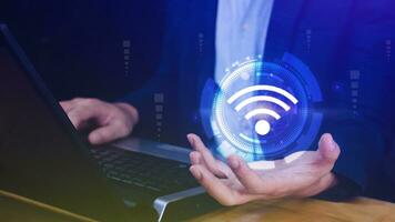Businessman using holding with wifi icon. Social network business communication concept, Wifi wireless concept free network Internet concept. photo