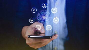 ESG icon concept use a smartphone to analyze ESG for environmental, social and governance in sustainable and ethical business on the Network connection, businessman pressing button on screen. photo
