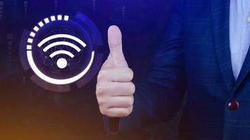 Businessman using thumb up with wifi icon. Social network business communication concept, Wifi wireless concept free network Internet concept. photo