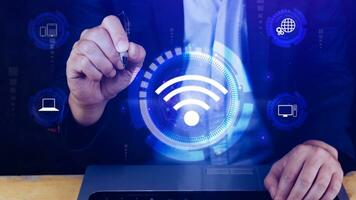 Businessman using touching with wifi icon. Social network business communication concept, Wifi wireless concept free network Internet concept. photo
