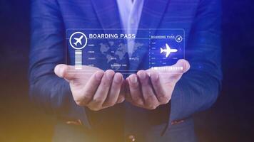 Businessman holding with boarding pass tickets air travel concept, Choosing checking electronic flight ticket, Booking ticket Online flight travel concept photo