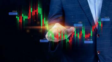 Hand of businessman or trader is touching growing virtual hologram stock, planning and strategy, Stock market, Business growth, progress or success concept. invest in trading. photo