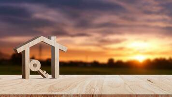 Mockup wooden house and key on wooden table, concept of real estate investment. Planning savings money of coins buy home concept for property, mortgage and real estate investment. photo