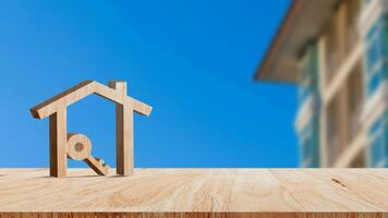 Mockup wooden house and key on wooden table, concept of real estate investment. Planning savings money of coins buy home concept for property, mortgage and real estate investment. photo