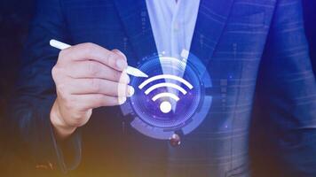 Businessman using touching with wifi icon. Social network business communication concept, Wifi wireless concept free network Internet concept. photo