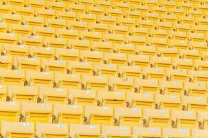 Empty yellow seats at stadium,Rows of seat on a soccer stadium,select focus photo