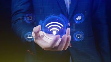 Businessman using holding with wifi icon. Social network business communication concept, Wifi wireless concept free network Internet concept. photo
