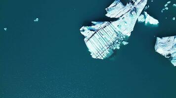 Aerial top down view of a glacier in lake Jokulsarlon in Iceland 4K 30p video