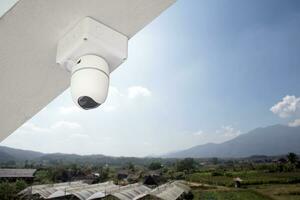 ip cctv camera installed on high ceiling of the house to do the security by monitoring through mobile phone and computer to save human life and property, soft and selecitve focus. photo