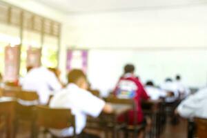 Blurred image of classroom during final test of secondary school in rural area of Thailand, concept for educational events background around the world. photo