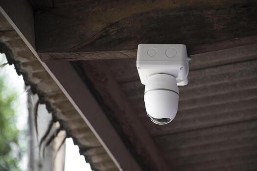 ip cctv camera installed on high ceiling of the house to do the security by monitoring through mobile phone and computer to save human life and property, soft and selecitve focus. photo