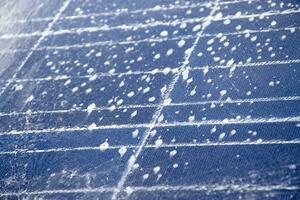 Front and upper surface of photovoltaic or solar cell panel which washing by water and soap to save and use it for a long time, soft and selective focus. photo