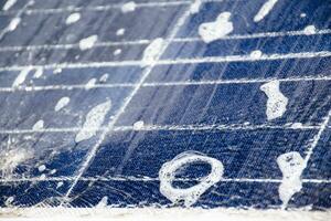 Front and upper surface of photovoltaic or solar cell panel which washing by water and soap to save and use it for a long time, soft and selective focus. photo