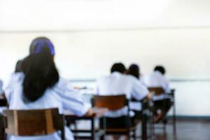 Blurred image of classroom during final test of secondary school in rural area of Thailand, concept for educational events background around the world. photo