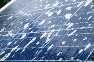 Front and upper surface of photovoltaic or solar cell panel which washing by water and soap to save and use it for a long time, soft and selective focus. photo