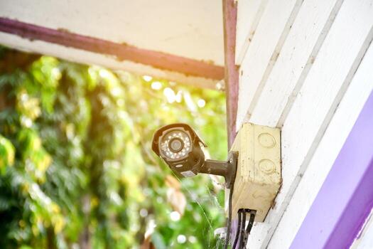 ip cctv camera installed on high ceiling of the house to do the security by monitoring through mobile phone and computer to save human life and property, soft and selecitve focus. photo