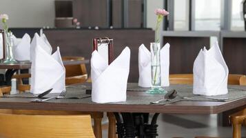 Table napkin and dining set at the restaurant. Food and beverage business concept. photo