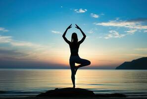 Girl in yoga pose on the beach photo