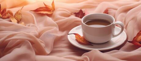 Coffee cup and autumn leaves photo