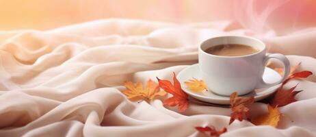 Coffee cup and autumn leaves photo