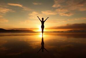 Girl in yoga pose on the beach photo