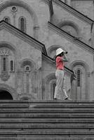 Photographer Taking Picture of Holy Trinity Cathedral of Tbilisi Geougia. Fade Color photo