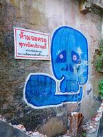 Chiang Mai, Thailand, 2023 - A wall art of blue skull photo