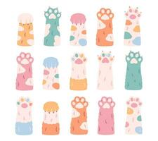 Cute colorful cats paws collection. Different funny pet paws with claws, animals hands. vector