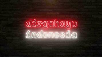 Dirgahayu indonesia day with neon text effect in wall background. Seamless looping video