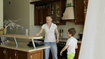 a woman is washing dishes in a kitchen video