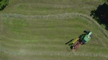 an aerial view of a man on a lawn mower video